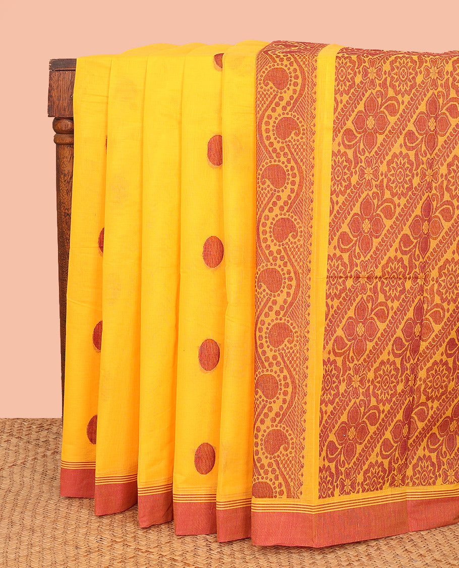 Yellow Kanchi Cotton Saree, Decked Up with Polka Dot Buttas All Over Its Body, Complemented by a Contrast Border, Pallu Depicting Floral Designs, and Paired with a Matching Blouse