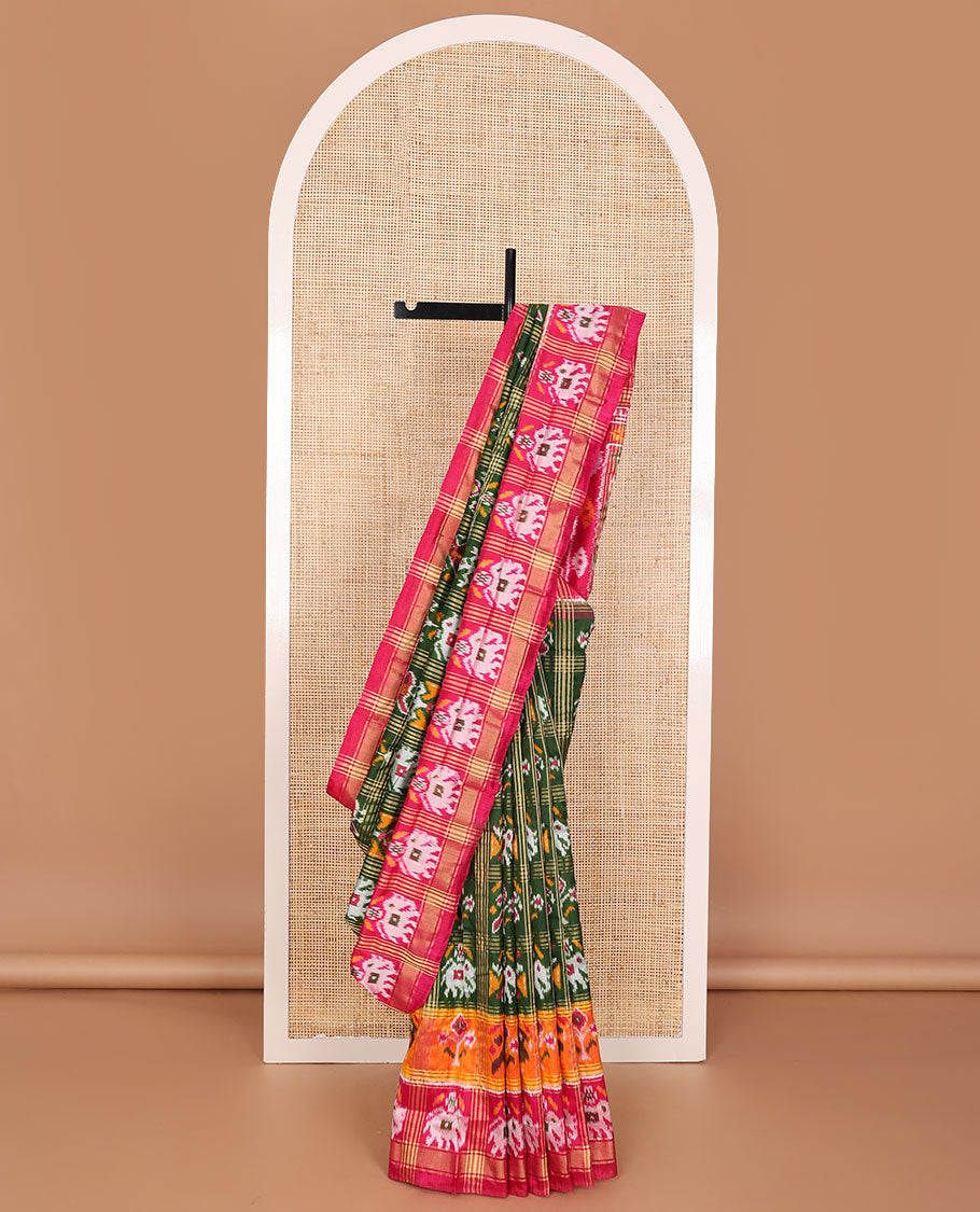 Green patola-style animal motif enclosed checked ikkat saree, contrast elephant motif border & pallu of ikkat designs