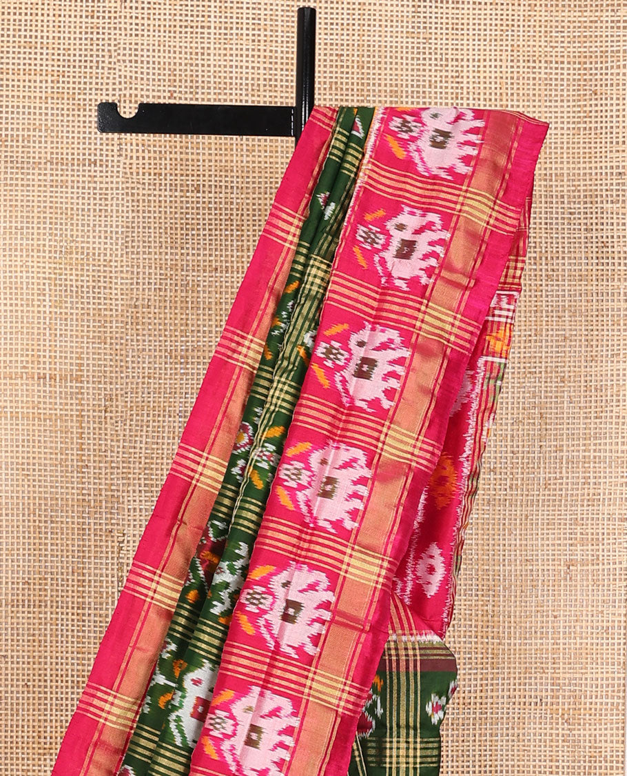Green patola-style animal motif enclosed checked ikkat saree, contrast elephant motif border & pallu of ikkat designs