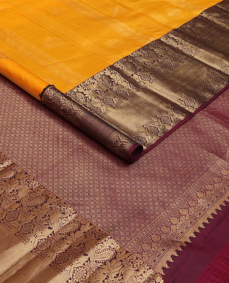 Orange zari designs silk saree, contrast border of mayil, chakram, & kuyil kann & jaal pallu