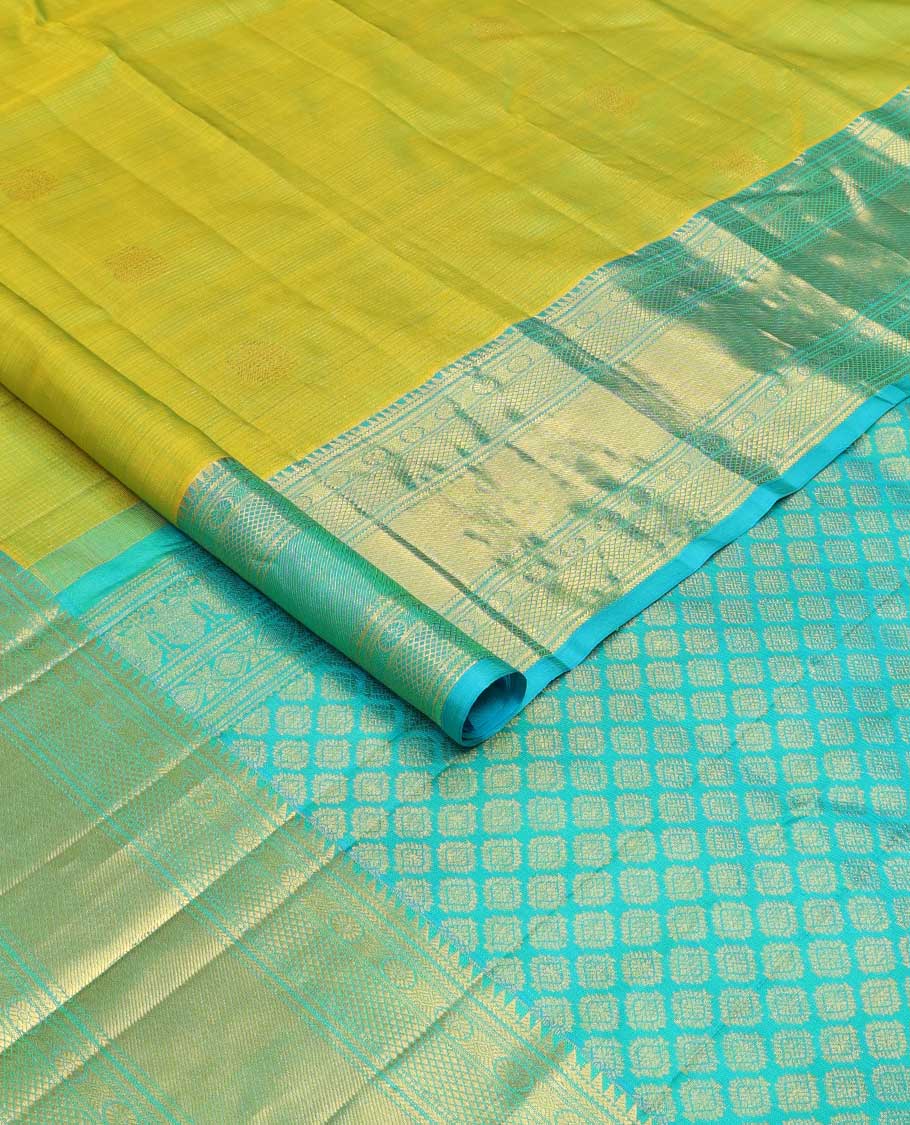 Leaf green zari buttas checked Kanchipuram silk saree, contrast border of ara bogudi,chakram and kuyil kann and jaal pallu