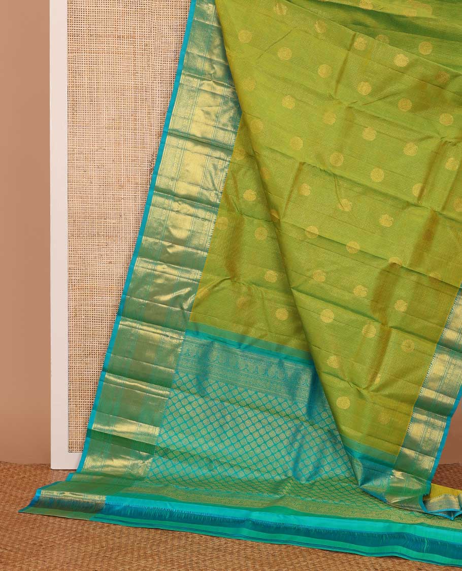 Leaf green zari buttas checked Kanchipuram silk saree, contrast border of ara bogudi,chakram and kuyil kann and jaal pallu