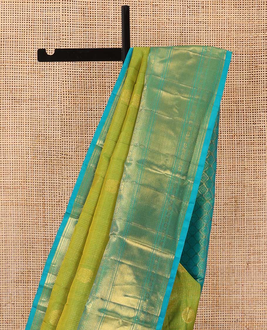 Leaf green zari buttas checked Kanchipuram silk saree, contrast border of ara bogudi,chakram and kuyil kann and jaal pallu