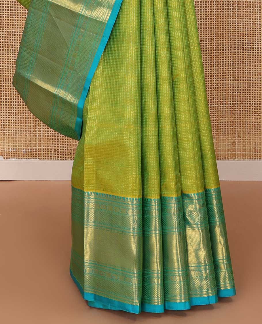 Leaf green zari buttas checked Kanchipuram silk saree, contrast border of ara bogudi,chakram and kuyil kann and jaal pallu