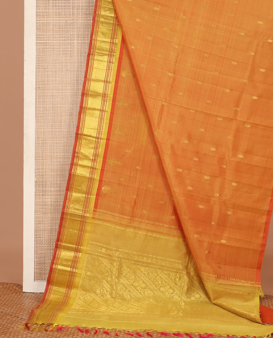 Orange zari buttas Kanchipuram silk saree, contrast one-sided border of panner sombu, muthu, banaras, and jaal, and floral creeper pallu