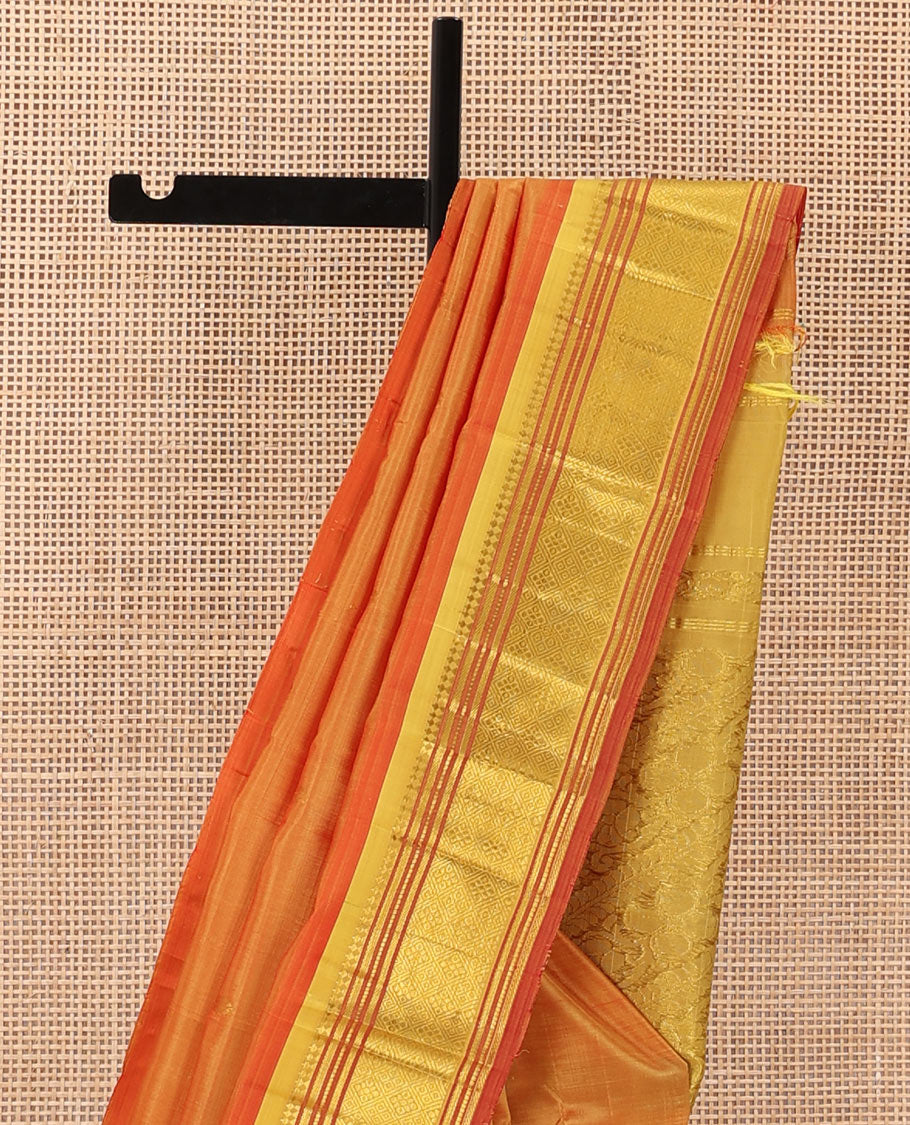 Orange zari buttas Kanchipuram silk saree, contrast one-sided border of panner sombu, muthu, banaras, and jaal, and floral creeper pallu