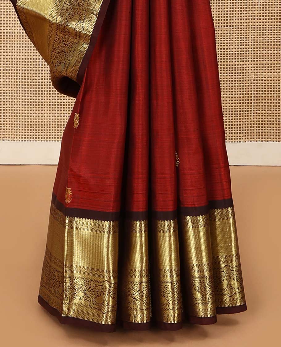 Rust zari buttas Kanchipuram silk saree, contrast border of thilakam mokku, muthu, poun, mayil kann, and manga designs, and zari design pallu