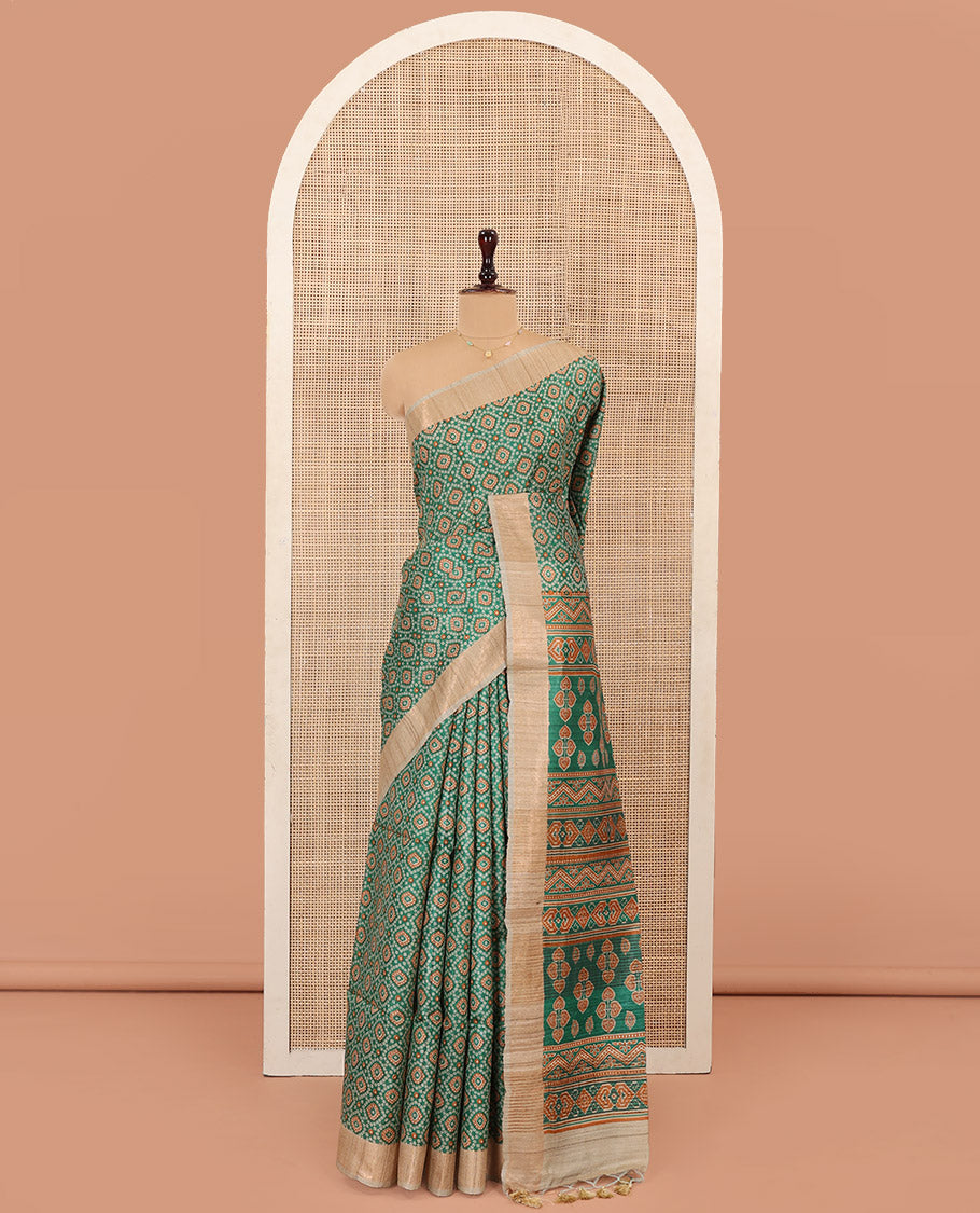 Green Tussar Silk Saree Beautified with Bandhani Dots Printed All Over Its Body, Complemented by Contrast Border, Pallu of Intricate Print, and Paired with a Contrast Blouse