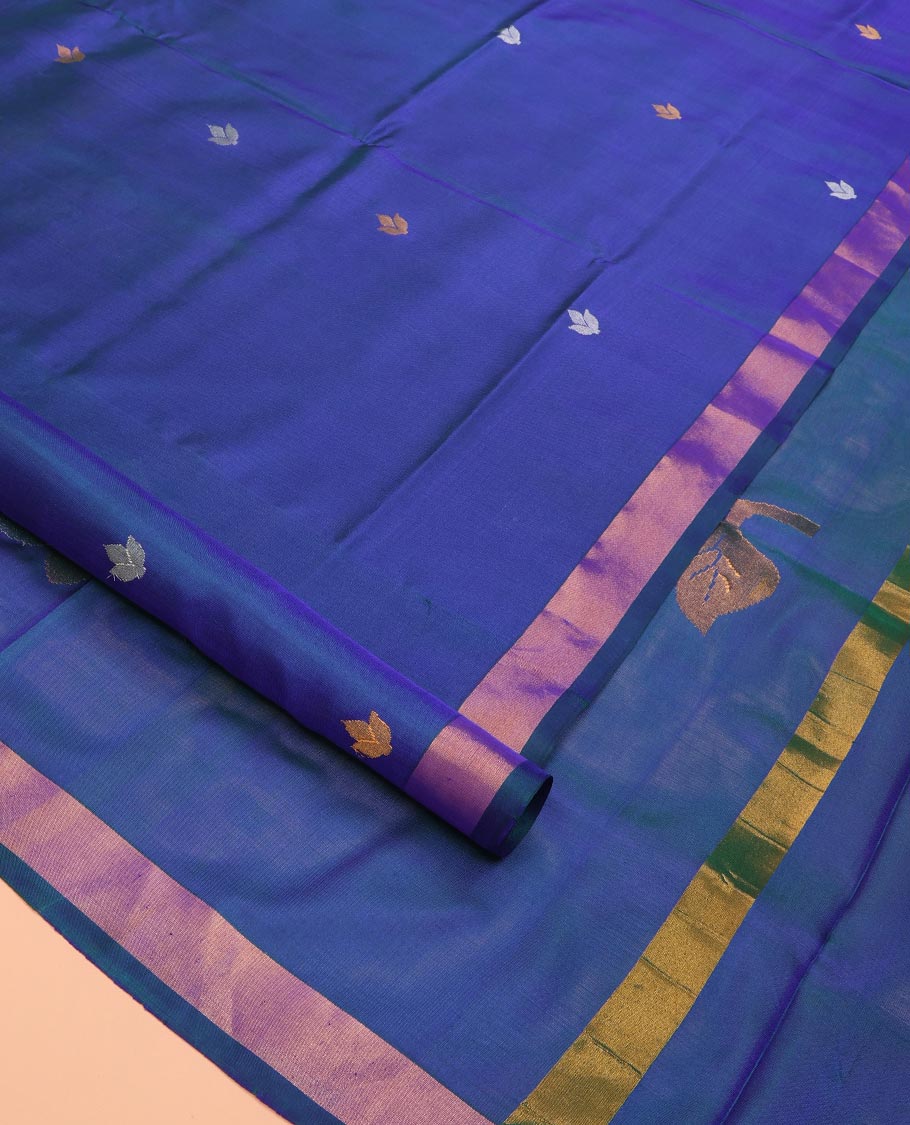 Blue Uppada Silk Saree Featuring Floral Buttas, Subtle Zari Bavanji Border, Pallu Decked Up with Jamdani-Style Floral Motifs, and Paired with a Matching Blouse