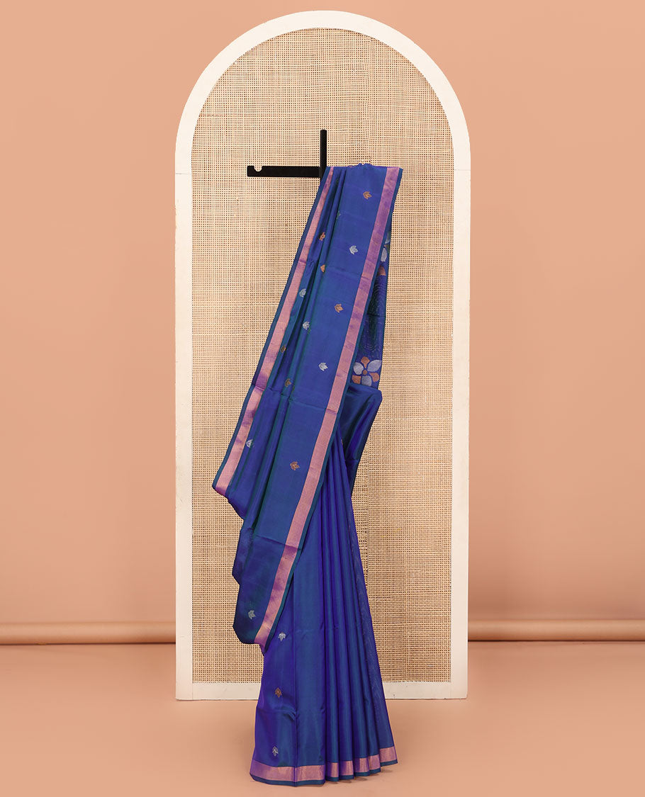 Blue Uppada Silk Saree Featuring Floral Buttas, Subtle Zari Bavanji Border, Pallu Decked Up with Jamdani-Style Floral Motifs, and Paired with a Matching Blouse
