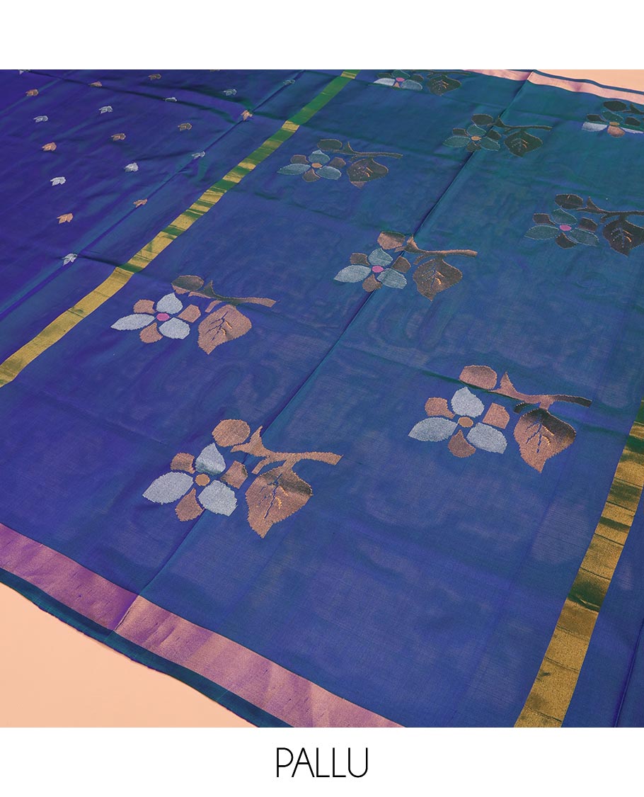 Blue Uppada Silk Saree Featuring Floral Buttas, Subtle Zari Bavanji Border, Pallu Decked Up with Jamdani-Style Floral Motifs, and Paired with a Matching Blouse