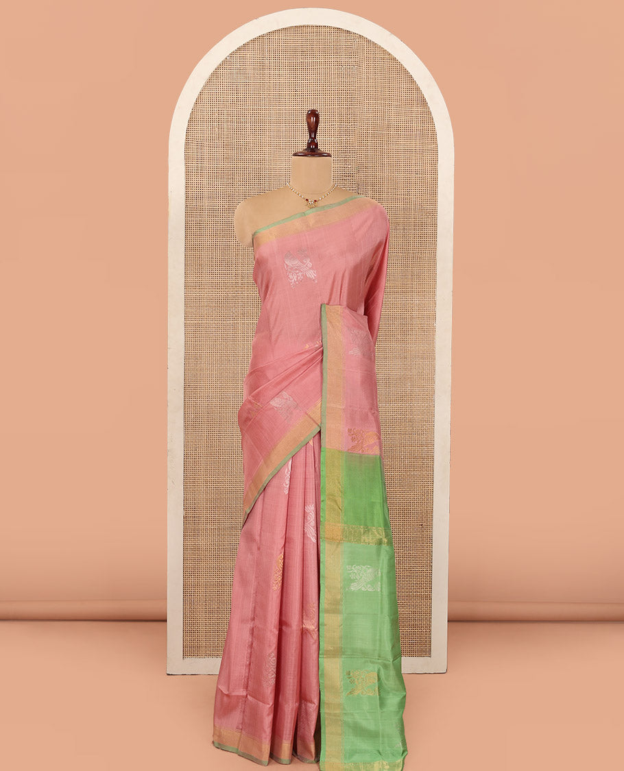 Pink Uppada Silk Saree Adorned with Parrot Zari Buttas, Complemented by Bavanji Border, Contrast Pallu Steeped with Parrot Zari Designs, and Paired with a Contrast Blouse