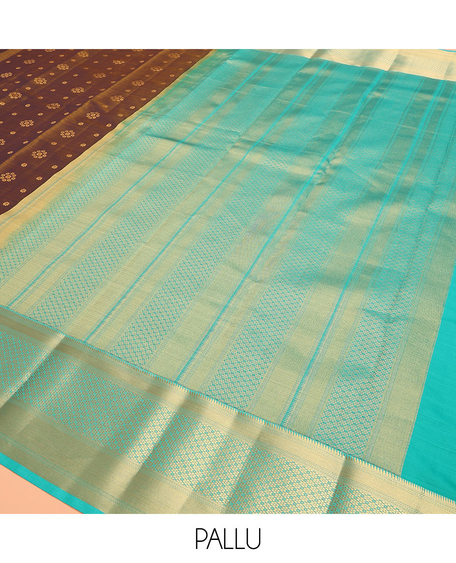 Brown Vasundhara Lite Silk Mix Saree Adorned with Zari Buttas, Complemented by a Contrast Border Featuring Ara Bogudi, Kathir, and Floral Designs, a Pallu Showcasing Floral Motifs, Paired with a Contrast Blouse