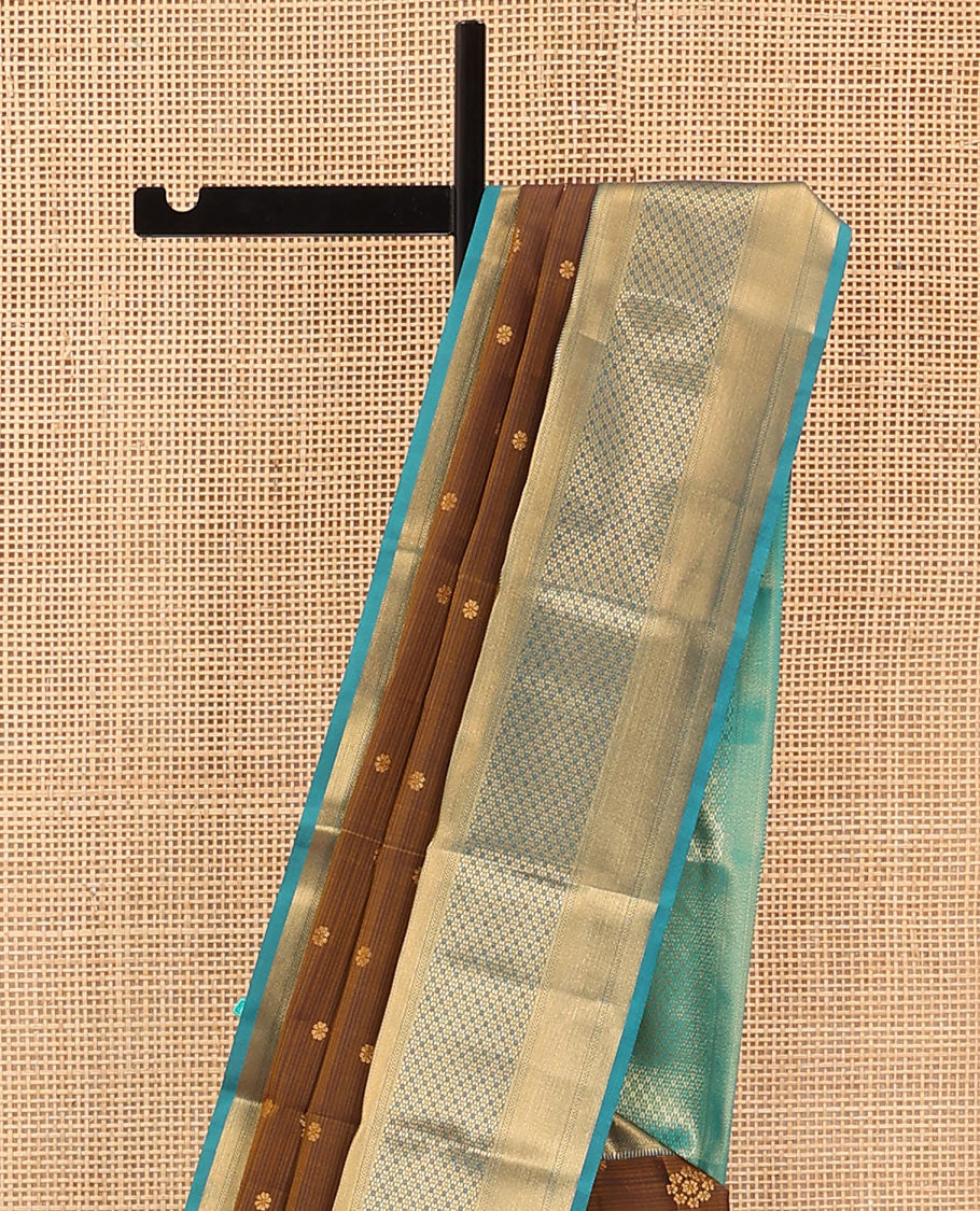 Brown Vasundhara Lite Silk Mix Saree Adorned with Zari Buttas, Complemented by a Contrast Border Featuring Ara Bogudi, Kathir, and Floral Designs, a Pallu Showcasing Floral Motifs, Paired with a Contrast Blouse
