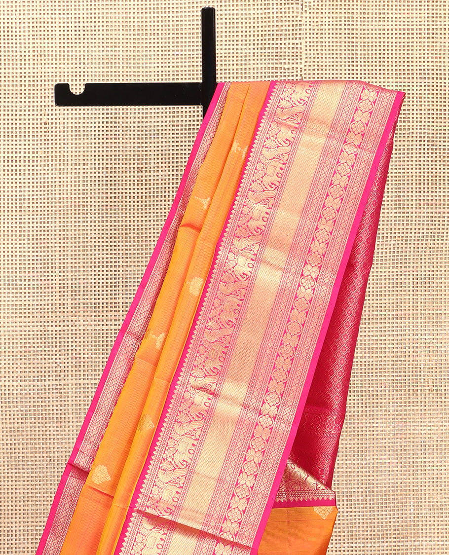 Orange Vasundhara Silk Saree, Entralled with Zari Buttas All Over Its Body, Complemented by Contrast Border of Mayil, Yaanai, Diamond and Floral Designs Grand Jaal Pallu and Paired with a Contrast