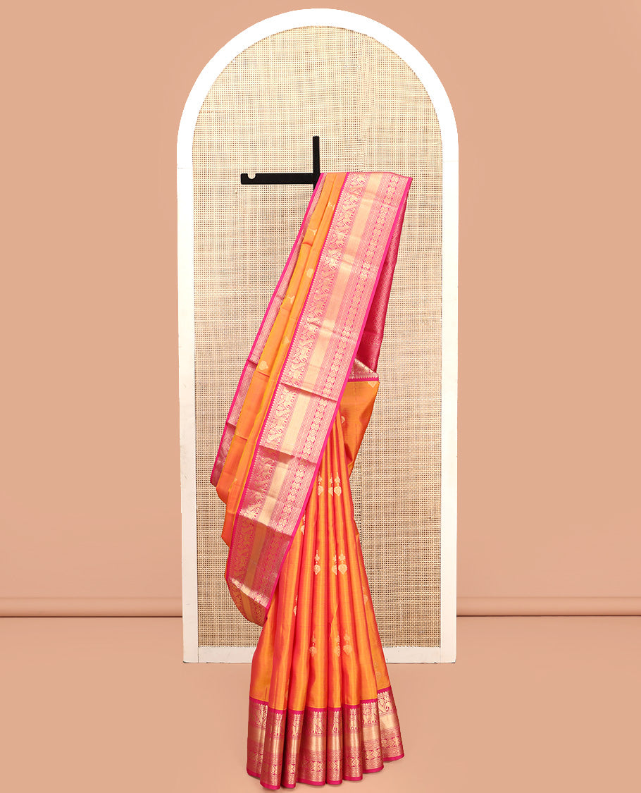 Orange Vasundhara Silk Saree, Entralled with Zari Buttas All Over Its Body, Complemented by Contrast Border of Mayil, Yaanai, Diamond and Floral Designs Grand Jaal Pallu and Paired with a Contrast