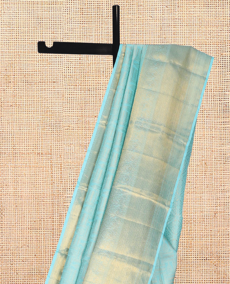 Pale Blue Jacquard Kanchipuram Wedding Silk Saree, Highlighted by a Zari Border of Thilakam Mokku, Arumbu Manga, and Mayil Kann Designs, Grand Jaal Pallu, and Matching Blouse