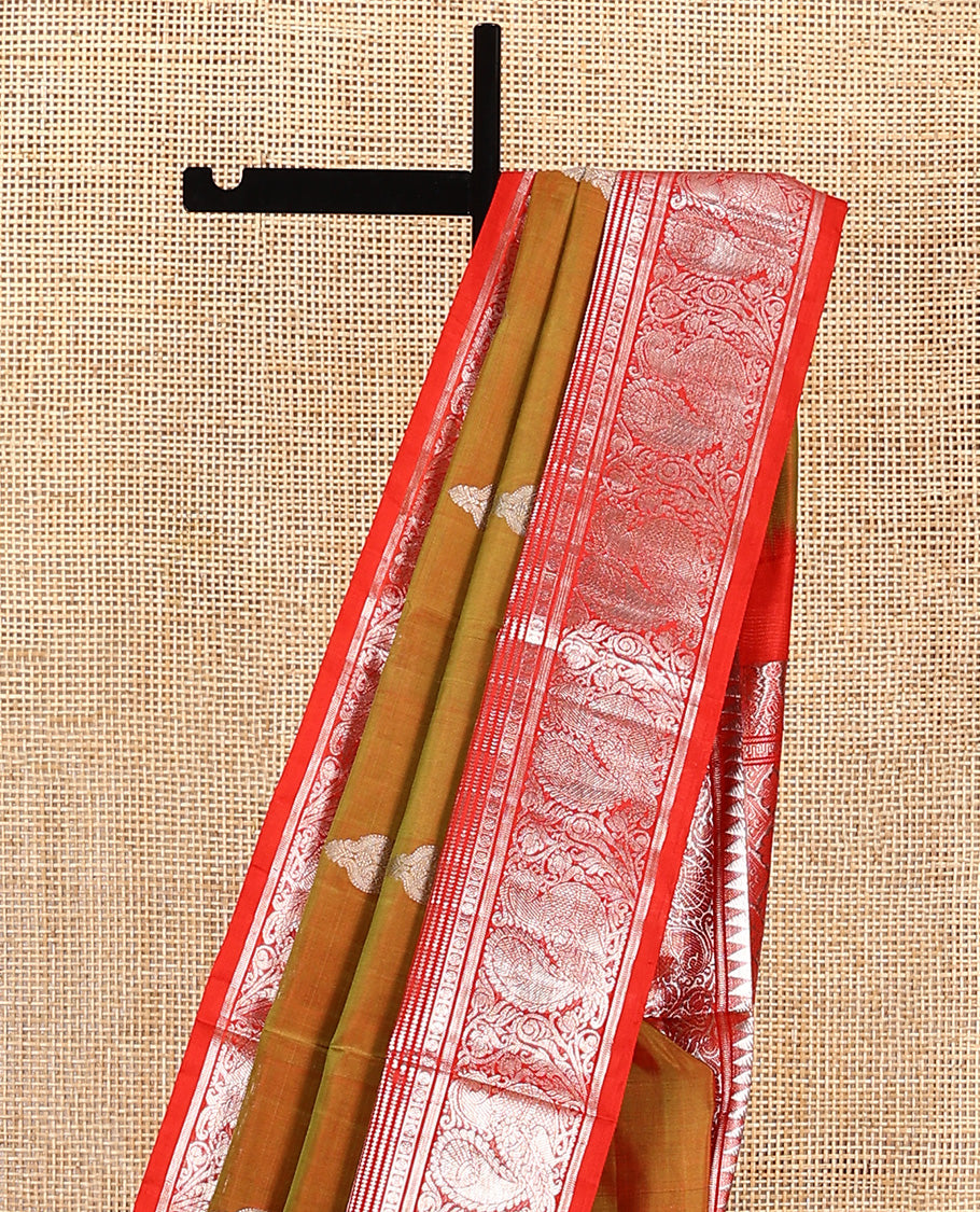 Green buttas Venkatagiri silk saree, contrast temple traditional border of peacocks, and intricate pallu