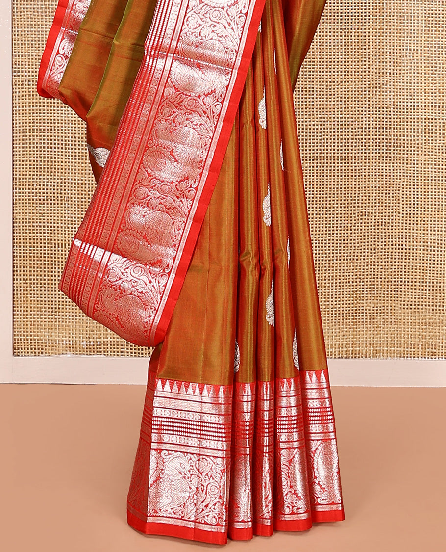 Green buttas Venkatagiri silk saree, contrast temple traditional border of peacocks, and intricate pallu