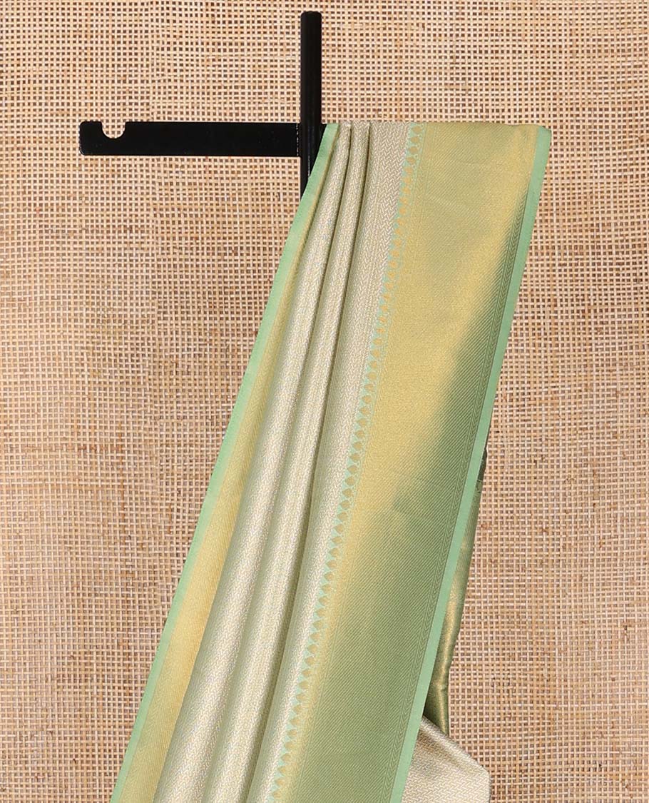 Mint green jacquard softy saree with contrast zari design border & floral design pallu