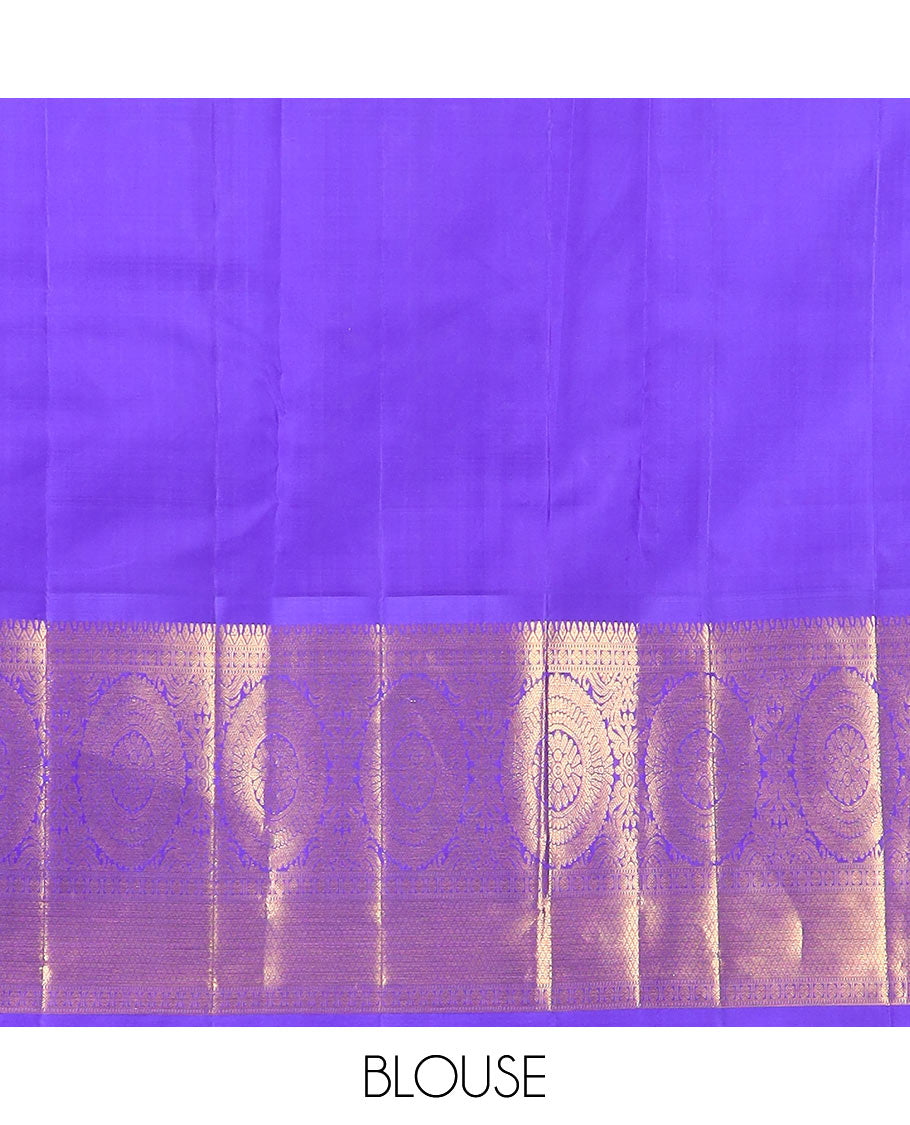 Blue chakram buttas Kanchipuram silk saree, contrast border of muthu, rudraksham, poo chakram, and mayil kann designs, and chakram motifs pallu