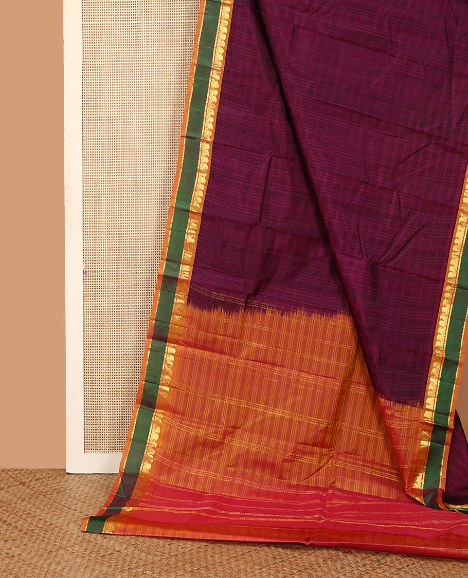 Purple Kanchipuram silk saree, contrast rettai pettu border of manga, neli, and diamond designs, and zari striped pallu