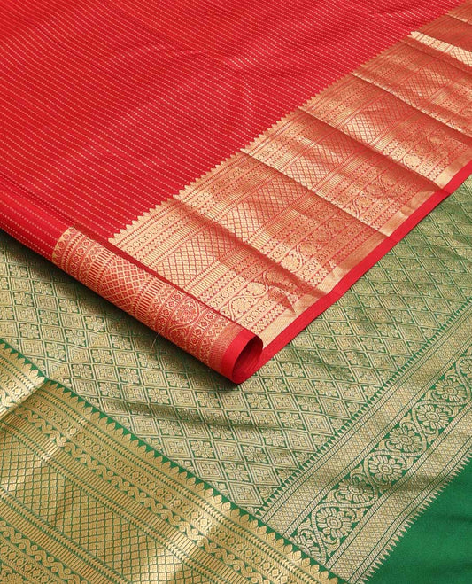 Red muthu striped silk saree, zari border of thilakam,ara bogudi, diamond, rettai neli, jaal and kodi visiry, and contrast jaal pallu