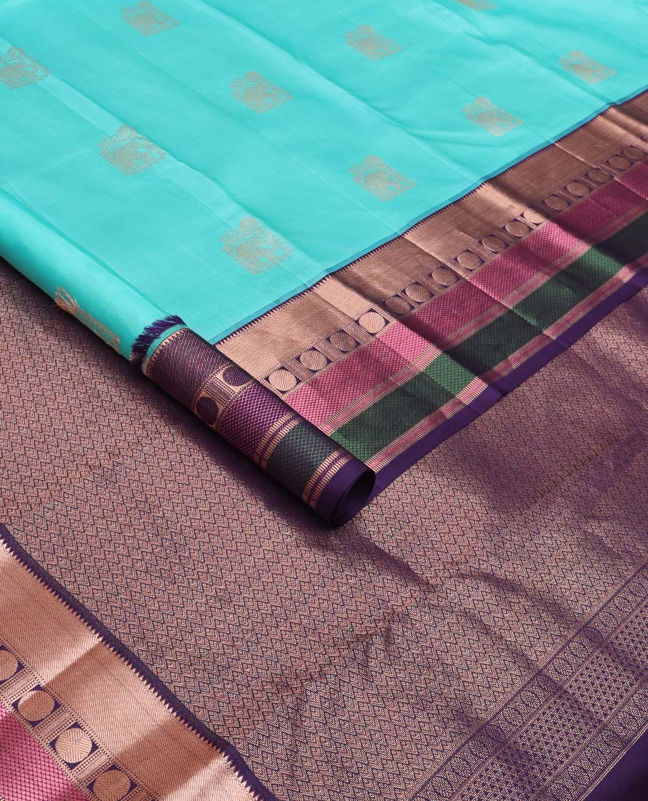 Blue yaanai buttas silk saree, contrast border of rekku, muthu, banaras, mayil kann, and rudraksham motifs, and jaal pallu