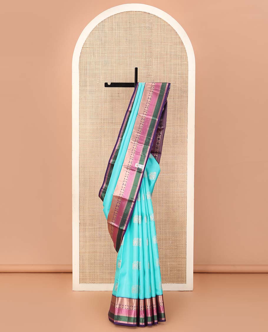 Blue yaanai buttas silk saree, contrast border of rekku, muthu, banaras, mayil kann, and rudraksham motifs, and jaal pallu