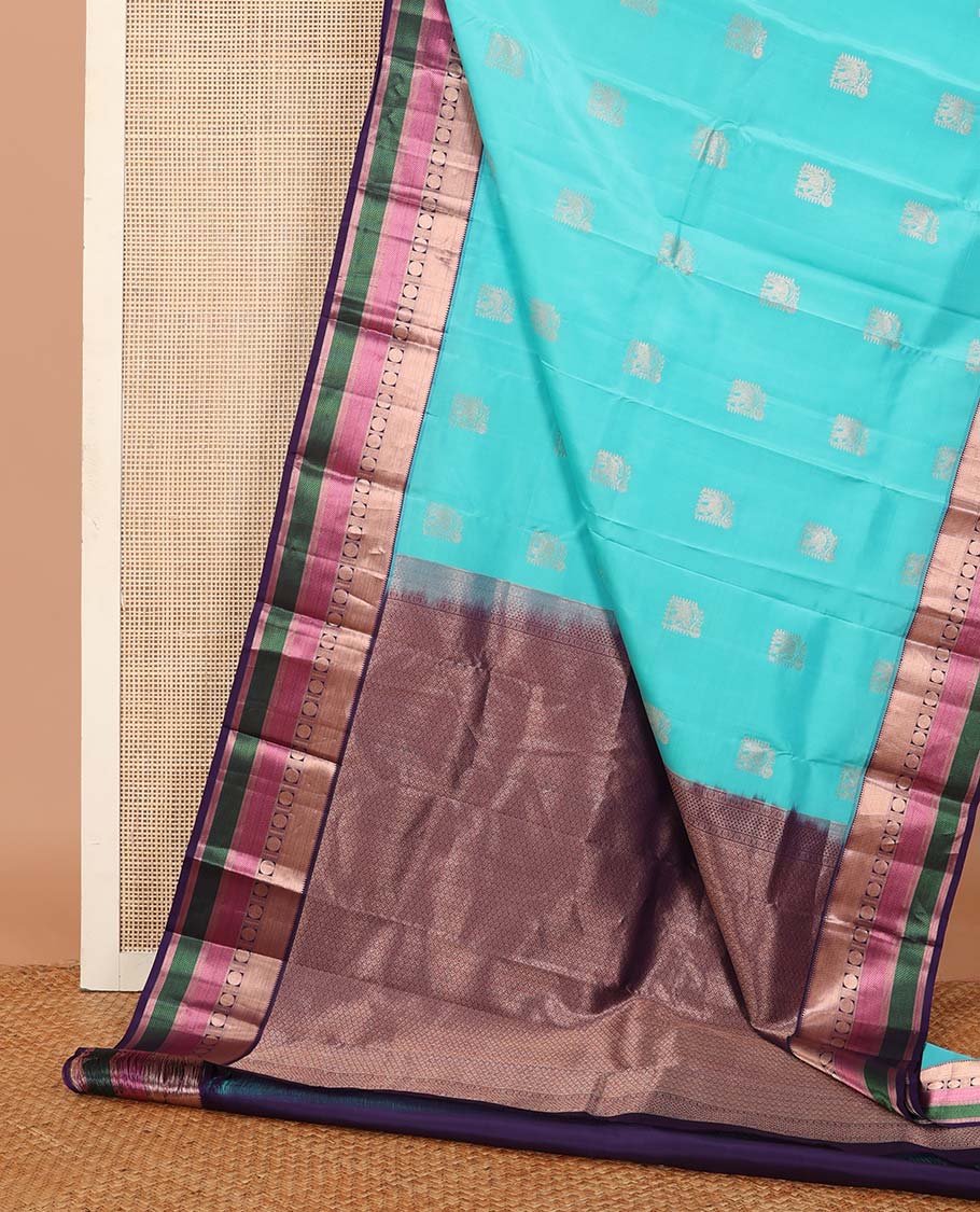 Blue yaanai buttas silk saree, contrast border of rekku, muthu, banaras, mayil kann, and rudraksham motifs, and jaal pallu