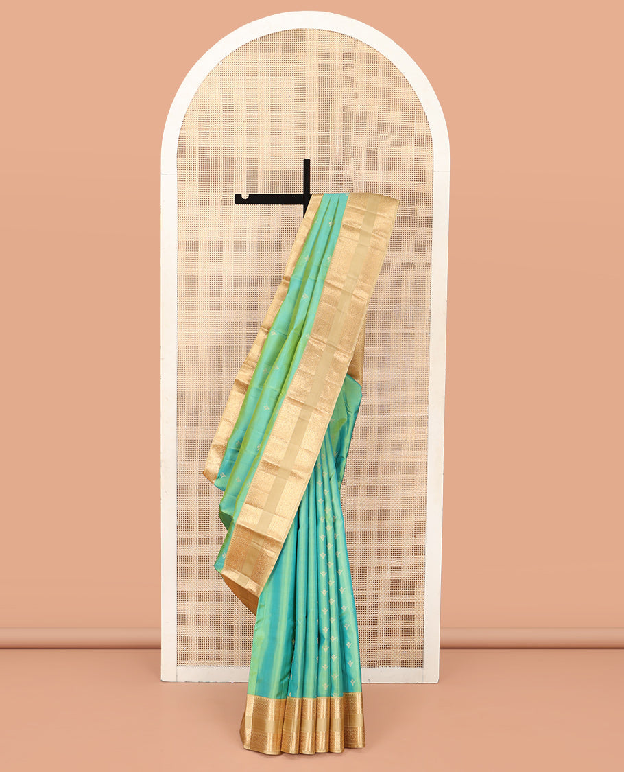 Turquoise Vasundhara Silk Saree, Crafted with Zari Buttas All Over Its Body, Complemented by a Contrast Rettai Pettu Border of Rekku, Muthu, Kathir, and Mayil Designs, Intricately Designed Pallu, and Paired with a Contrast Blouse