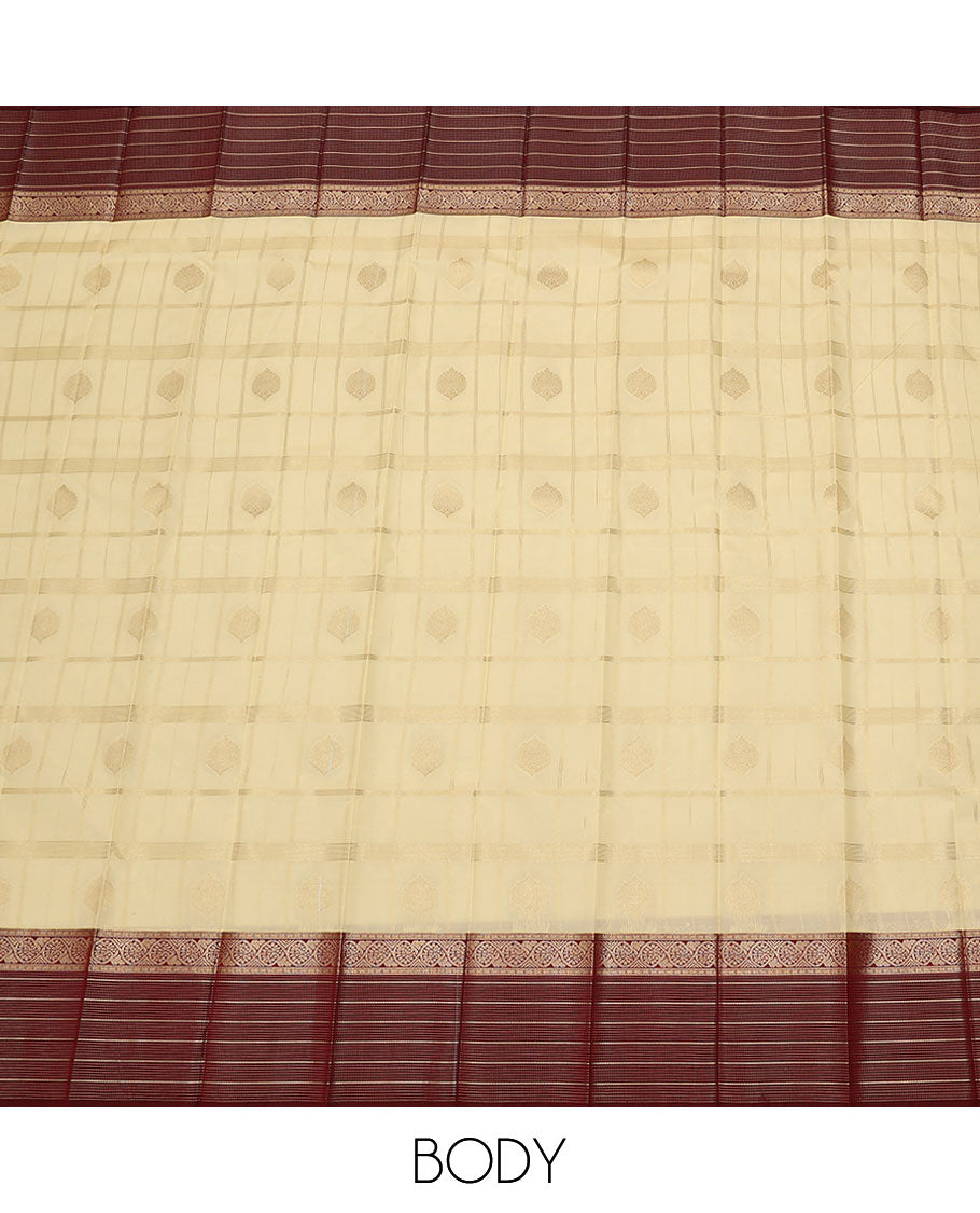 Cream butta enclosed checked budget silk saree, contrast traditional zari design border, and jaal pallu