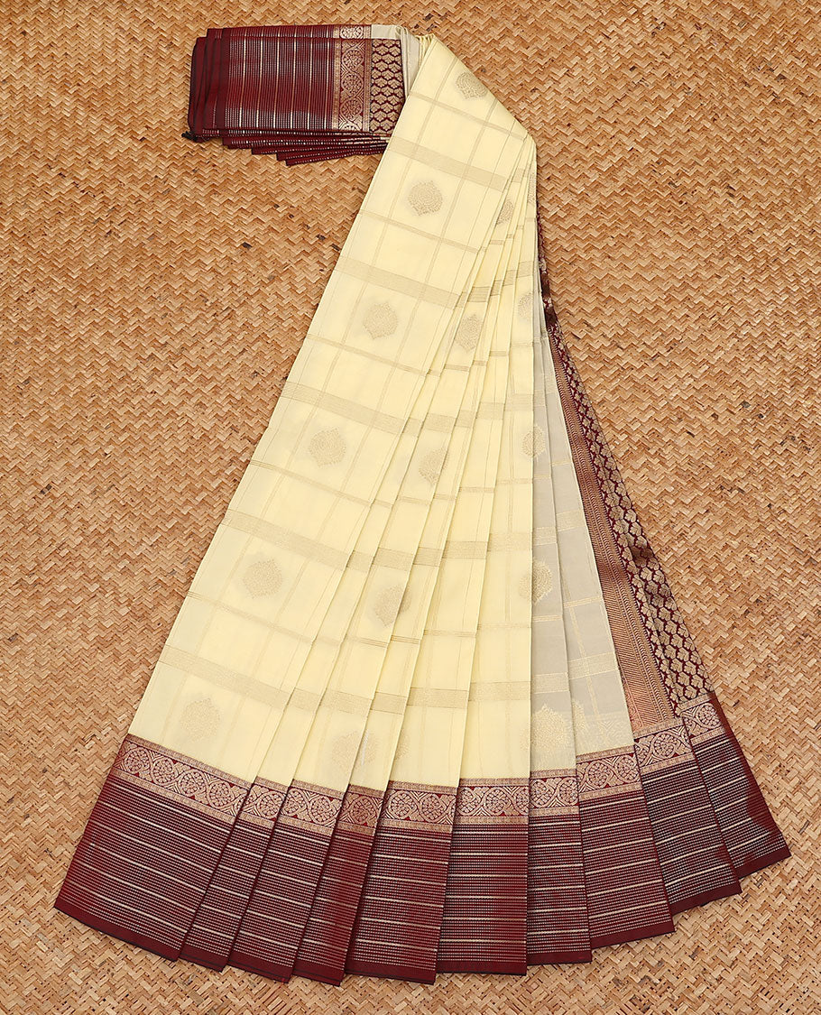 Cream butta enclosed checked budget silk saree, contrast traditional zari design border, and jaal pallu