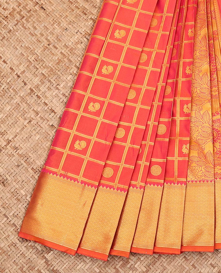 Orange Budget Silk Saree, Artfully Detailed with Peacock-Chakram Butta Enclosed Checks All Over Its Body, Highlighted by a Temple Zari Border of Traditional Designs, Pallu Depicts Mughal-Style Intricate Designs, and Paired with a Matching Blouse