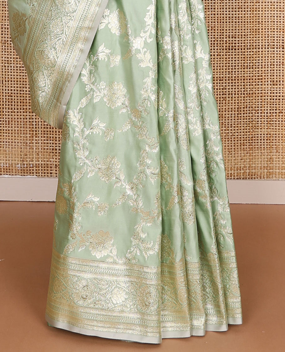 Pistachio green floral jacquard semi banaras satin, self-border & pallu steeped with intricate designs