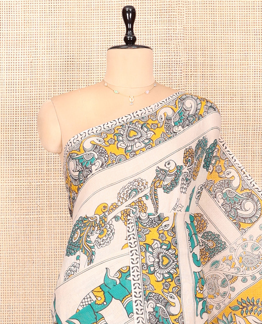 Off-White Kalamkari Cotton Saree Features Flora, Fauna, Human Motifs Print, Contrast Kalamkari Printed Border, Peacock Pallu, and a Matching Blouse