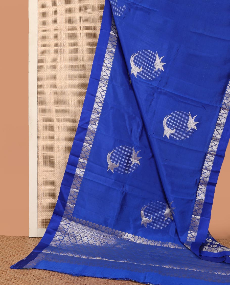 Royal blue zari buttas raw mango silk saree, floral-scallop border, and sliver color zari rich pallu of jaal design