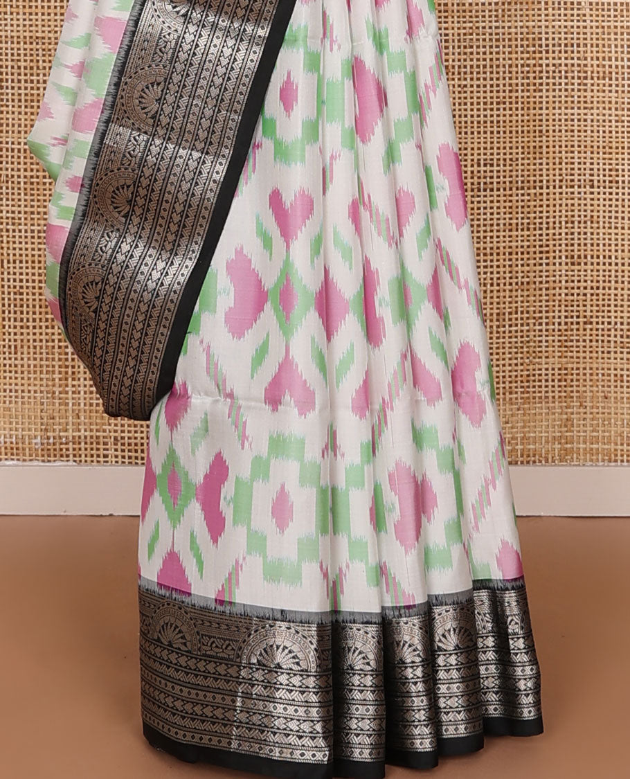 Half-white colorful jaal-patterned pure ikkat saree, contrast traditional zari design black border & pallu of geometric zari designs