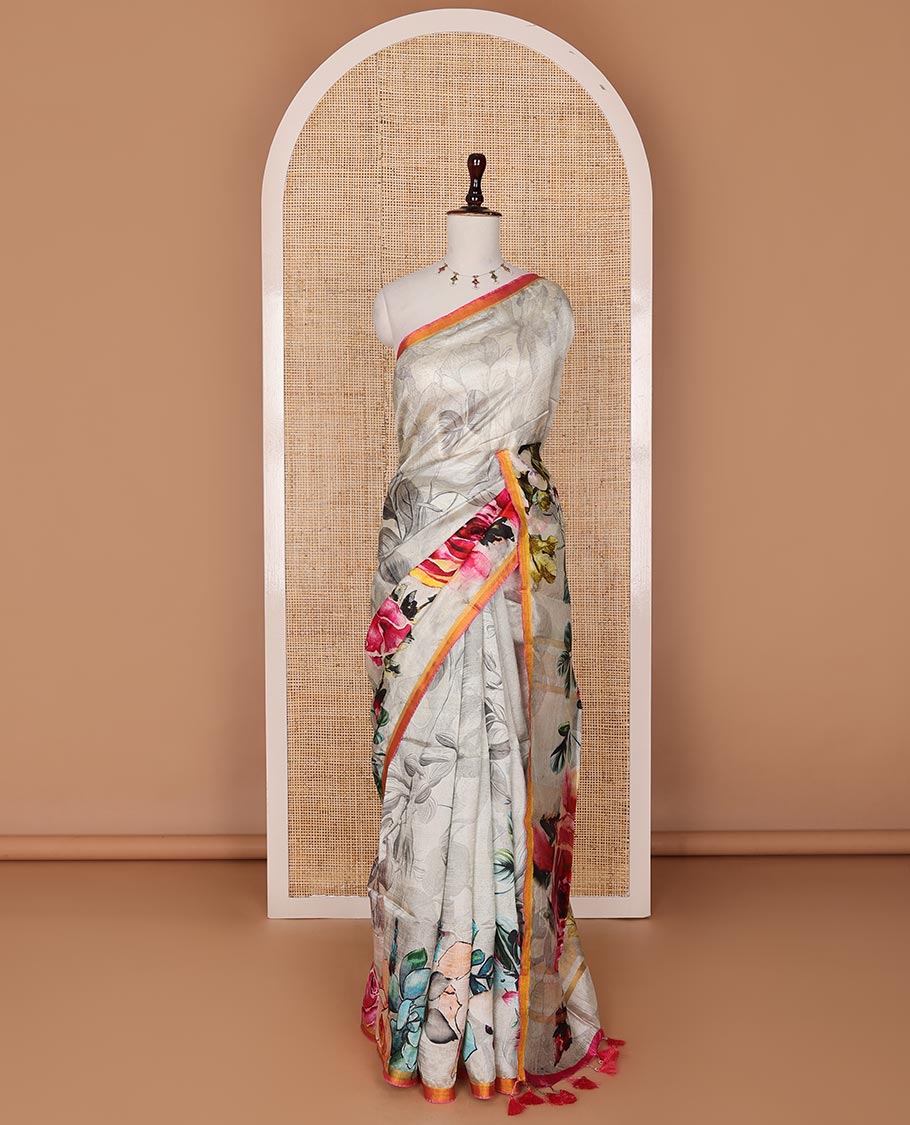 Half-white colorful floral printed banana pith saree, contrast piping border, and floral motifs printed pallu