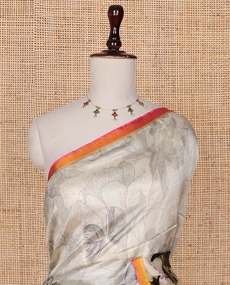 Half-white colorful floral printed banana pith saree, contrast piping border, and floral motifs printed pallu