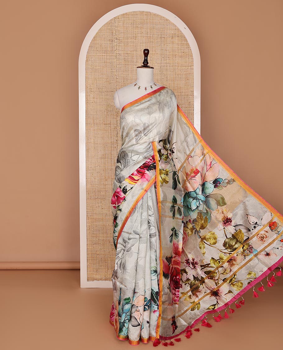 Half-white colorful floral printed banana pith saree, contrast piping border, and floral motifs printed pallu