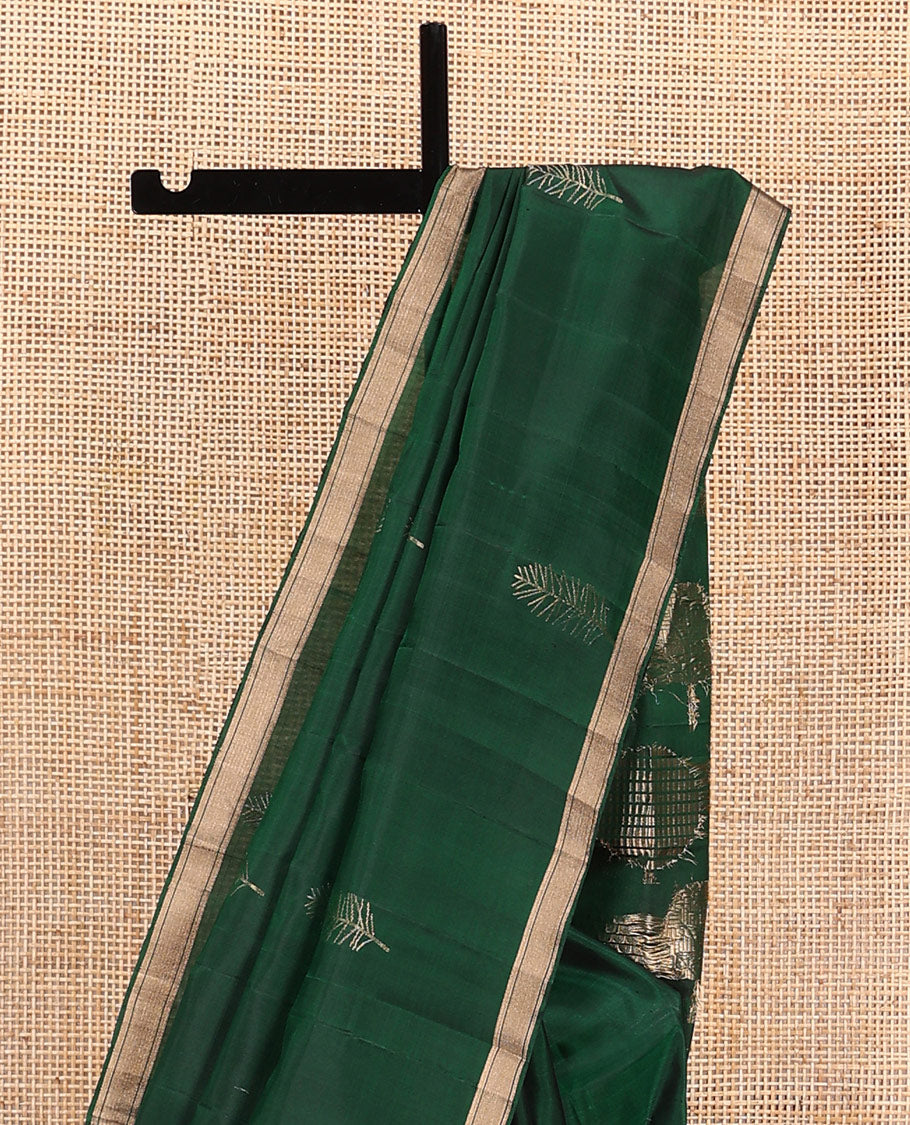 Green leaf buttas soft silk saree, piping zari border, and pallu steeped with unique leaf motifs