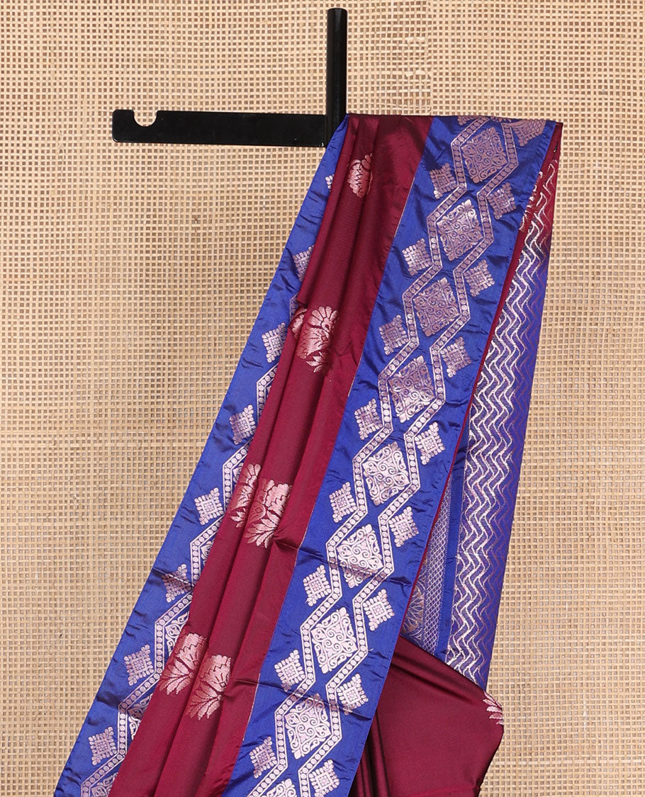 Maroon semi-soft silk saree with zari floral buttas, contrast diamond design zari border & chevron striped pallu