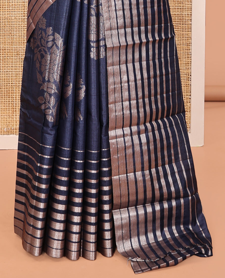Borderless Blue Tussar Silk Saree, Gracefully Embellished with Zari Stripes and Floral Buttas, Striped Pallu, and a Matching Blouse