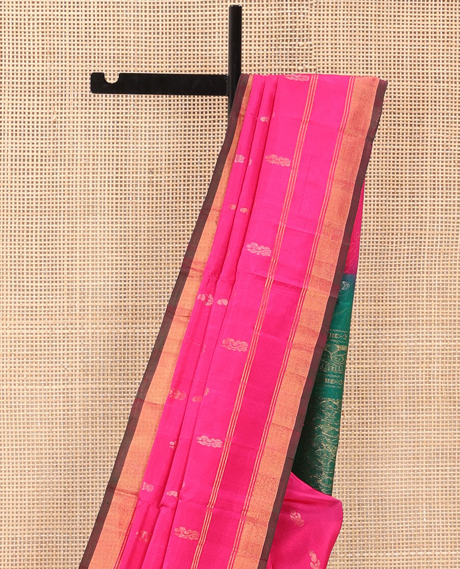 Rani Pink Uppada Silk Saree Elegantly Highlighted with Zari Buttas, Subtle Zari Border, Complemented by a Pallu of Peacock and Paisley Designs, and Paired with a Contrast Blouse