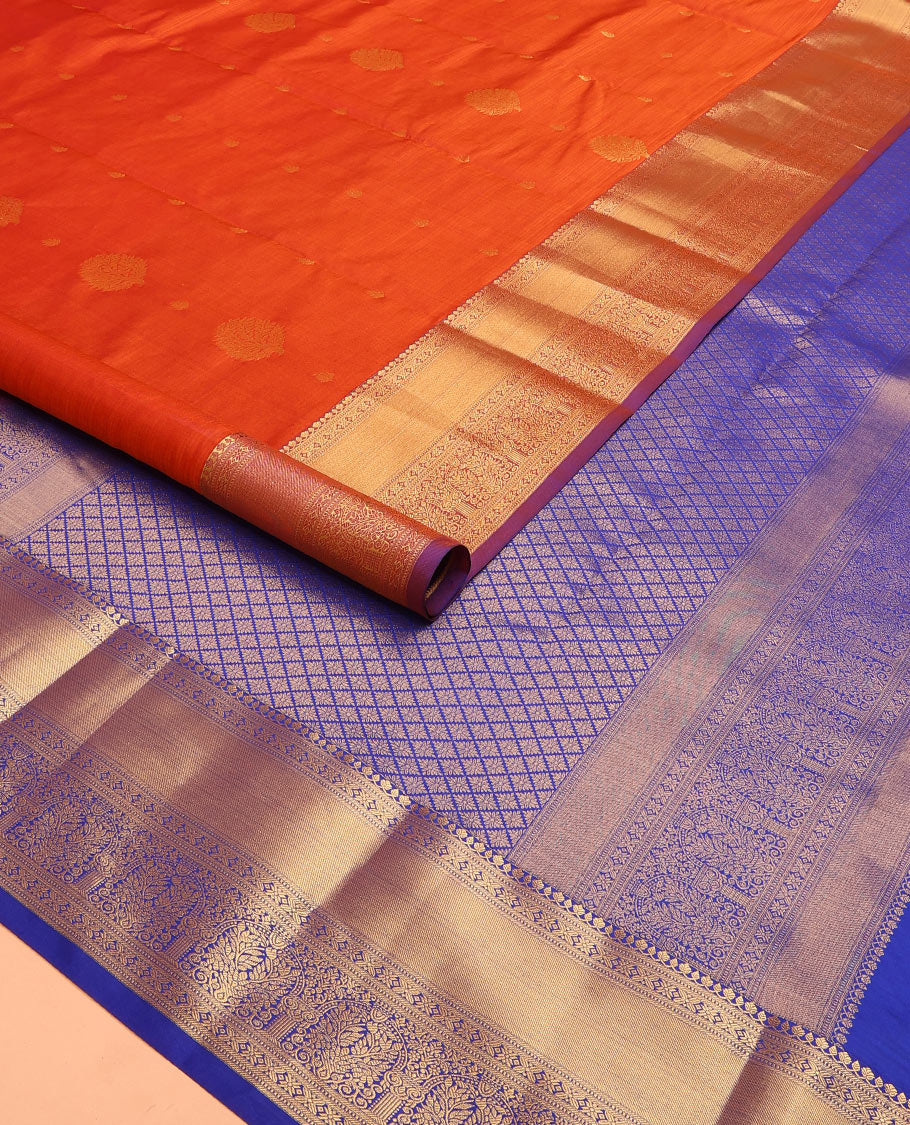 Orange Vasundhara Lite Silk Mix Saree Highlighted with Zari Buttas, Contrasting Zari-Woven Border with Traditional Designs, a Luxuriously Woven Pallu of Jaal Design, Along with a Contrast Blouse