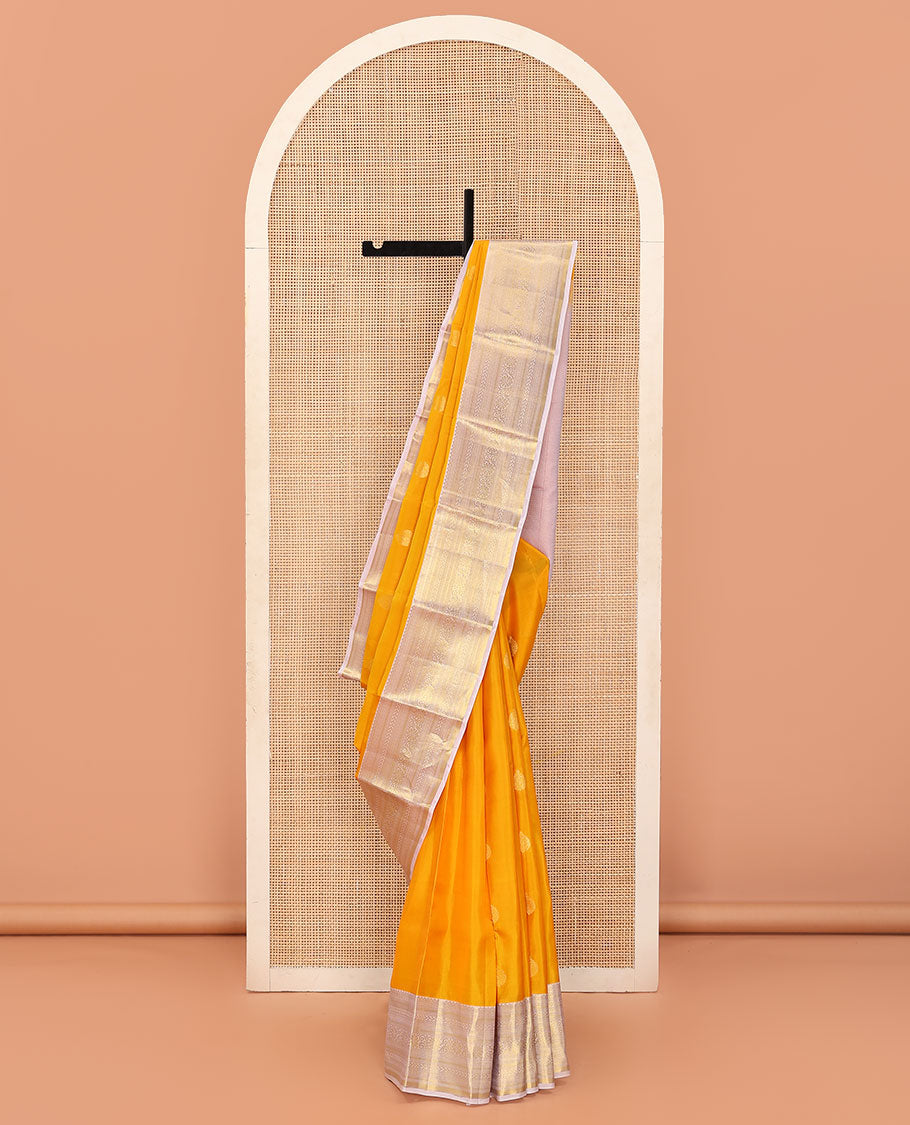 Yellow Vasundhara Lite Silk Mix Saree Subtly Sparked with Zari Buttas, Complemented with a Contrast Border of Rekku, Muthu, Neli, Diamond, Kathir, Mayil Kann, and Kodi Visiry Designs, Elevated with Zari Vanki Pallu, and a Contrast Blouse