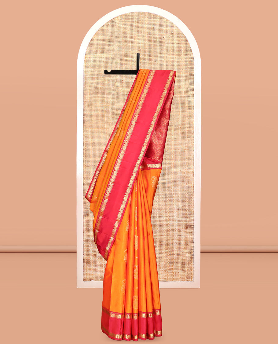 Orange Vasundhara Lite Silk Mix Saree, Ornamented with Zari Buttas, a Contrast Rettai Pettu Border of Mayil Designs, Jaal Pallu, and a Contrast Blouse