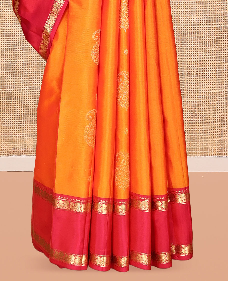 Orange Vasundhara Lite Silk Mix Saree, Ornamented with Zari Buttas, a Contrast Rettai Pettu Border of Mayil Designs, Jaal Pallu, and a Contrast Blouse