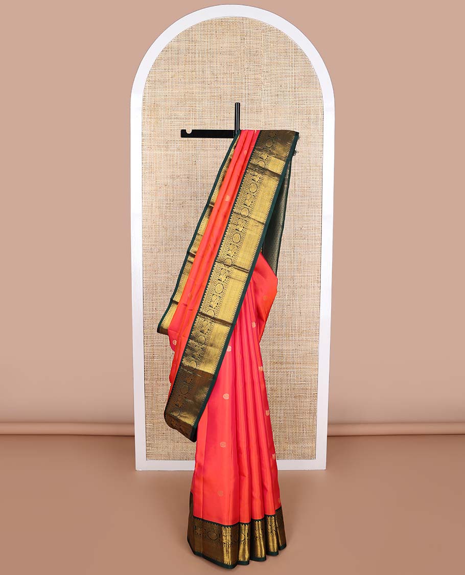 Red buttas silk saree with contrast border of manga, banaras, mayil , mayil kann, poo chakram design & zari design pallu